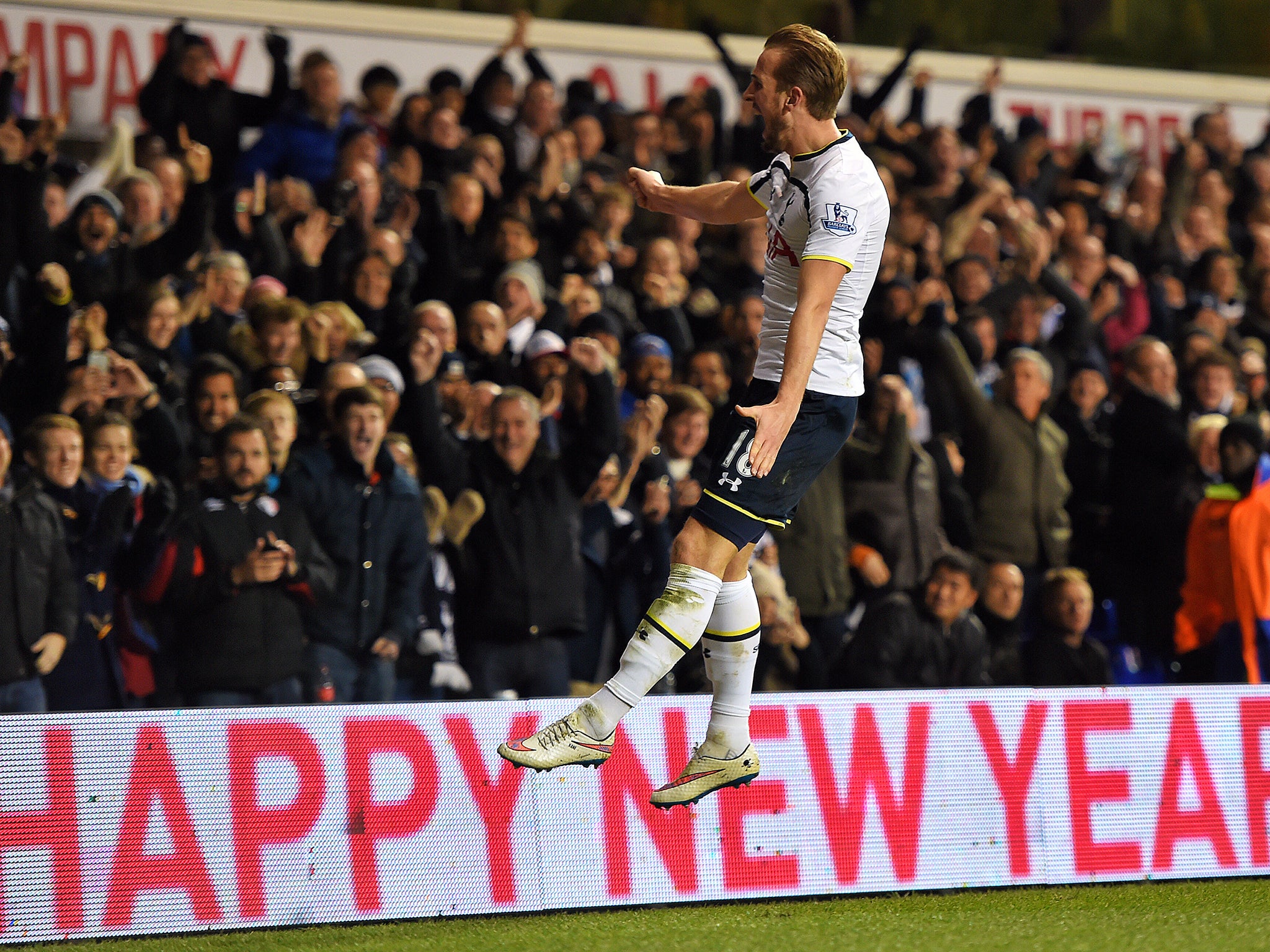 Harry Kane celebrates one of his two goals against Chelsea