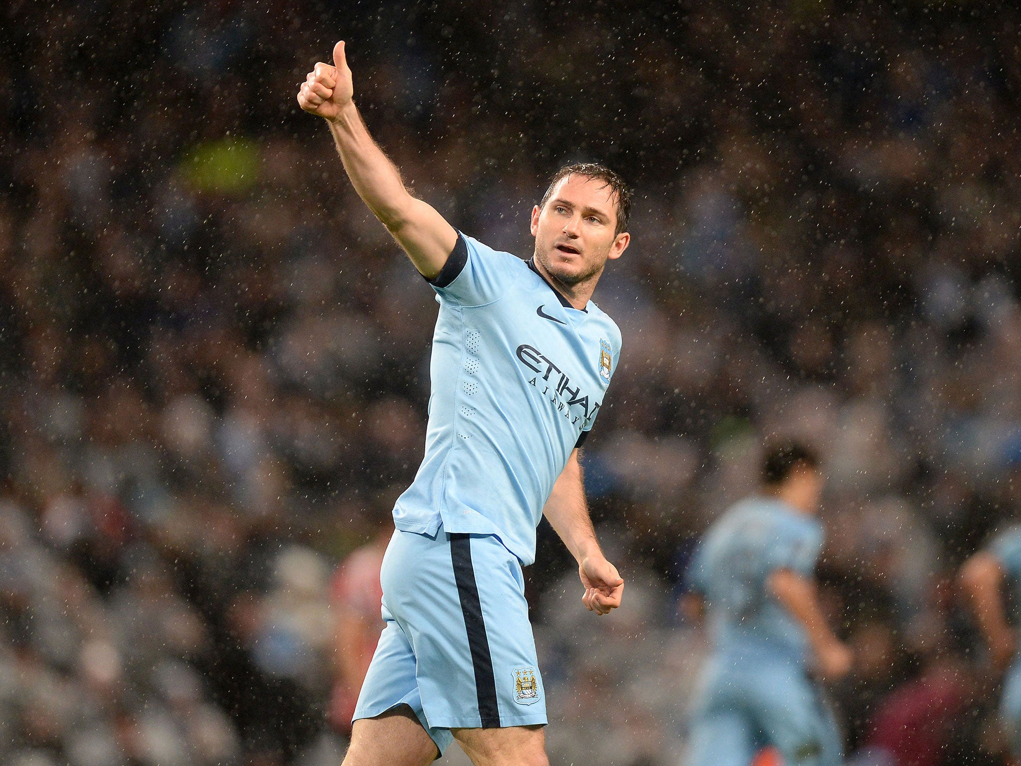 Manchester City's Frank Lampard celebrating scoring his sides third goal of the game during the Barclays Premier League match at the Etihad Stadium, Manchester