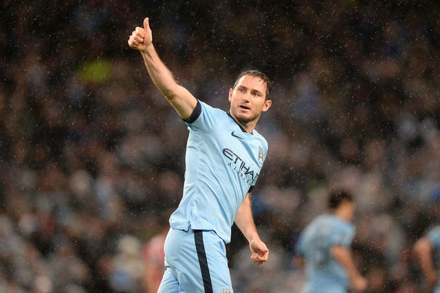 Manchester City's Frank Lampard celebrating scoring his sides third goal of the game during the Barclays Premier League match at the Etihad Stadium, Manchester 