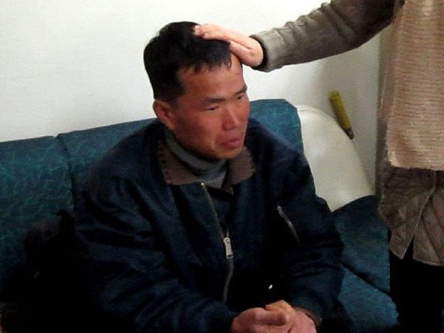 Kim Seong-baek, meets with his mother after he was rescued from a salt farm