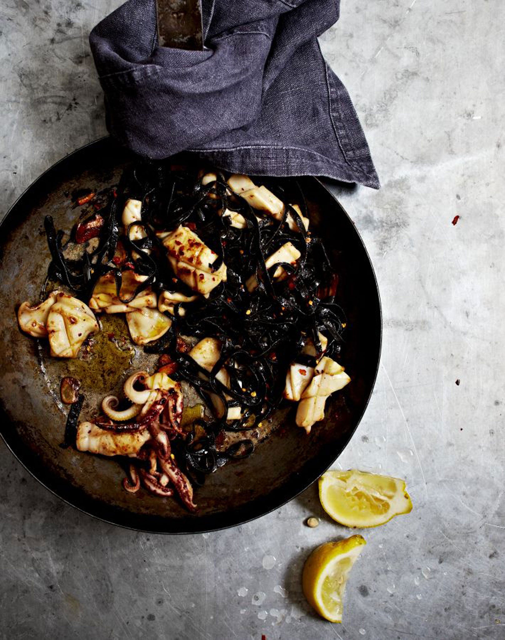 Garlic and chilli squid with squid-ink fettuccine