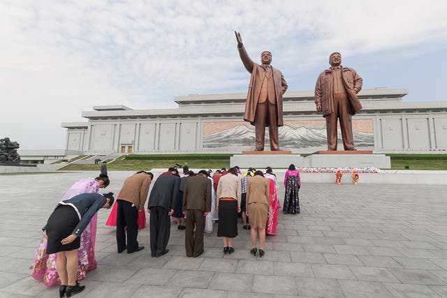 North Koreans pay homage before statues of former Presidents Kim Il Sung and Kim Jong Il, Mansudae Assembly Hall on Mansu Hill, Pyongyang