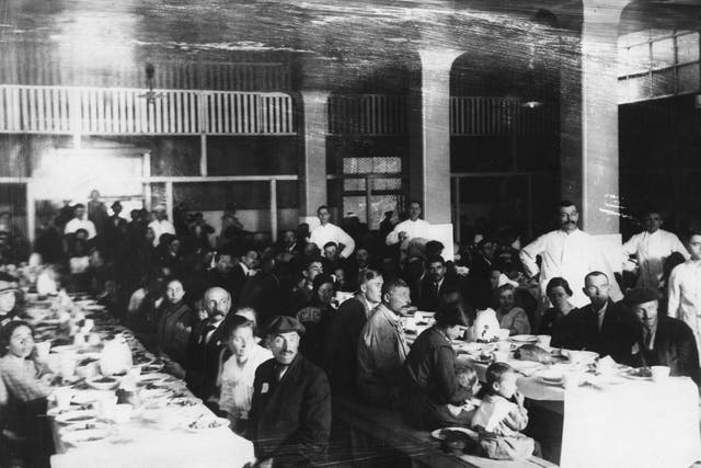 August 1923:  Immigrants in a dining hall on Ellis Island, New York.  