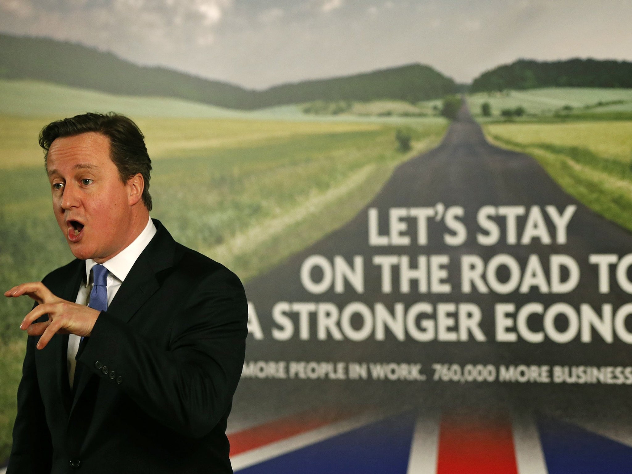 David Cameron in front of the new Conservative Party election poster yesterday