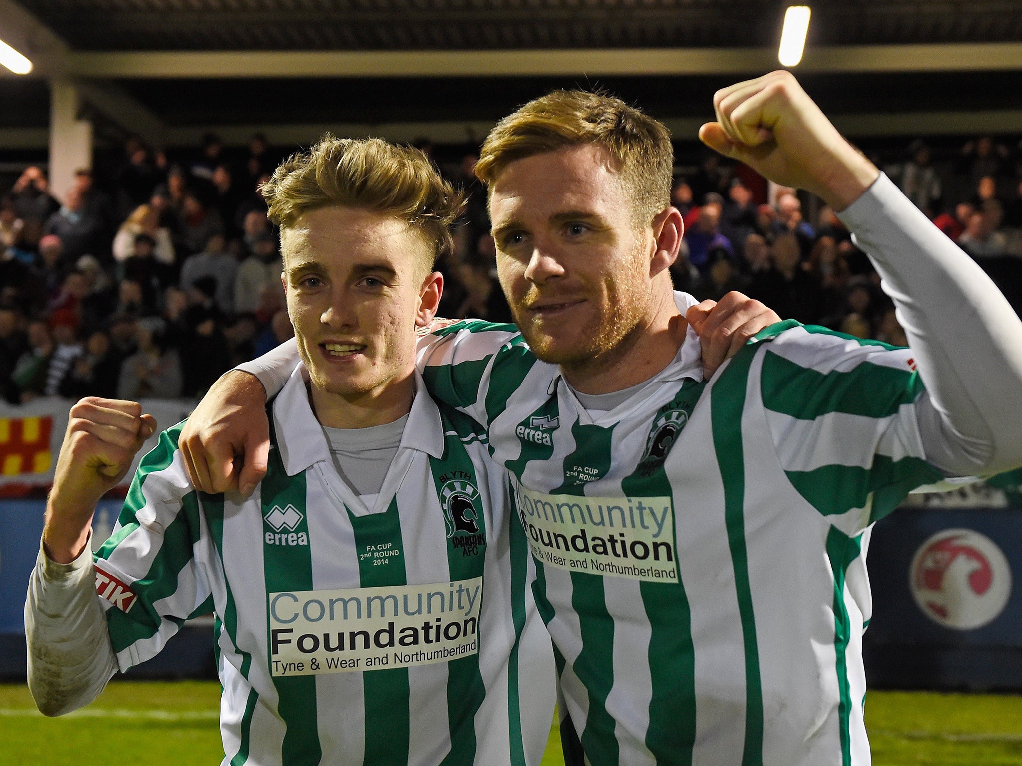 Scorer Jarrett Rivers (left) and Stephen Turnbull, of Blyth Spartans, celebrate victory after
their second round match against Hartlepool United last month