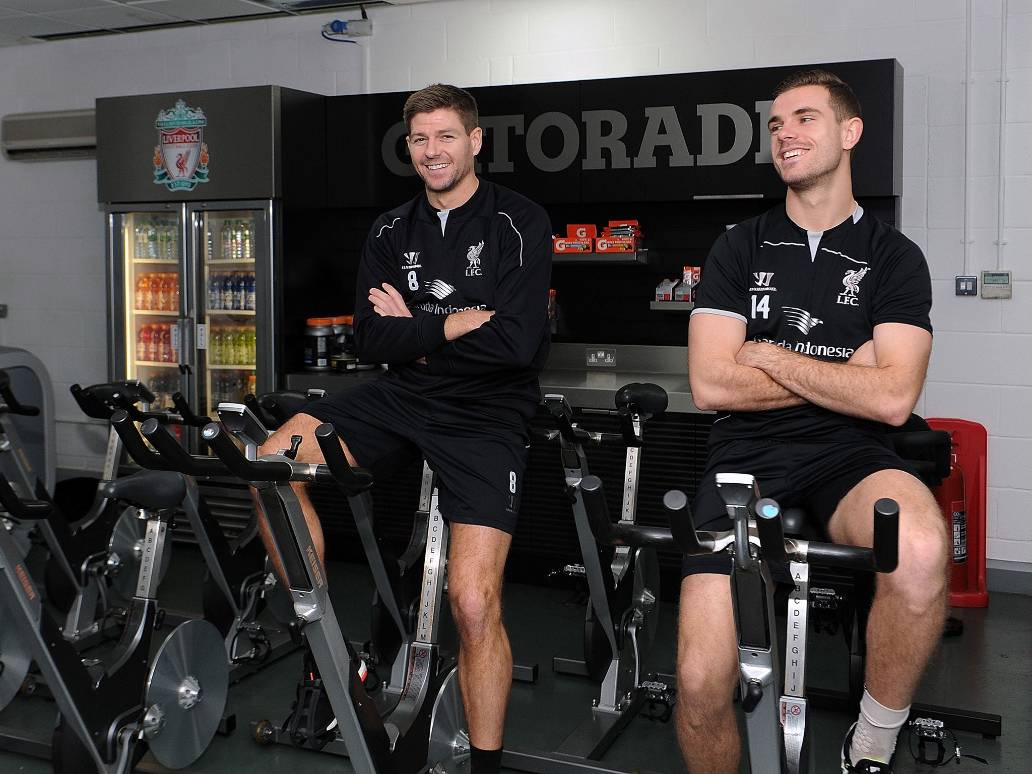 Gerrard alongside Henderson during a Liverpool training session