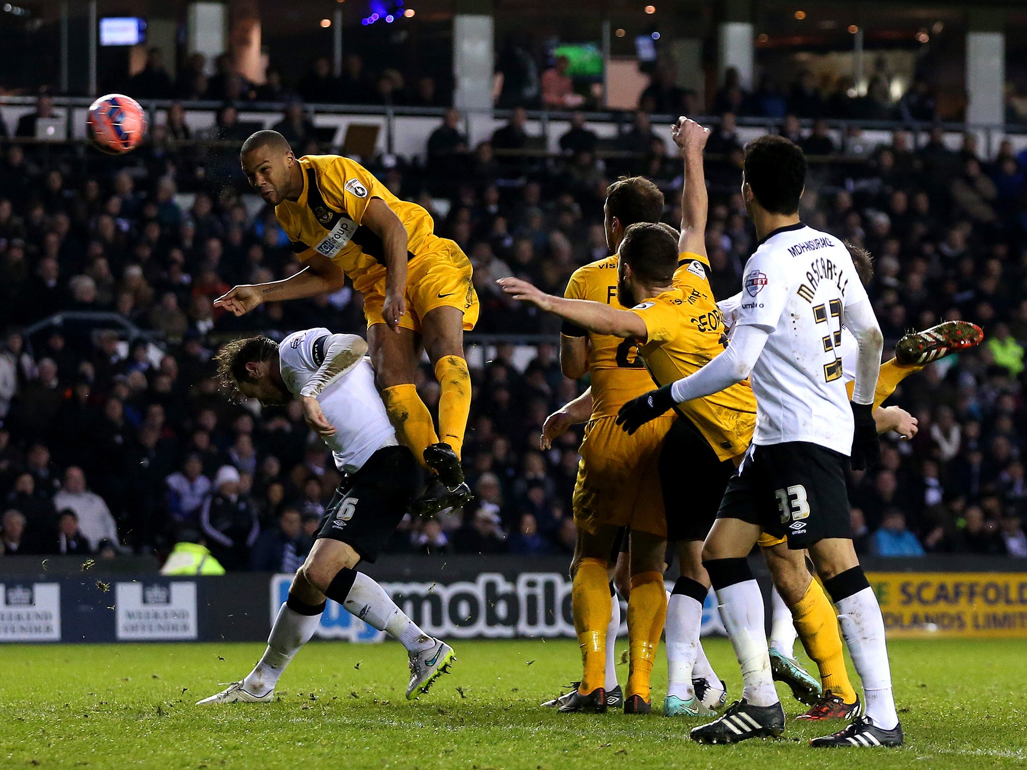 Dom Collins heads towards goal from a set-piece