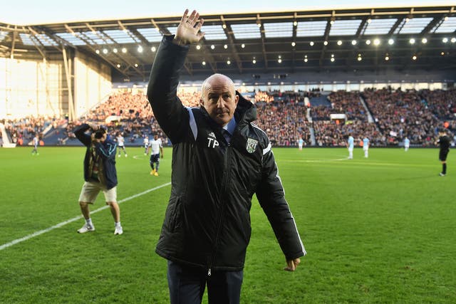 Tpny Pulis waves to the crowd ahead of his first game in charge of West Brom