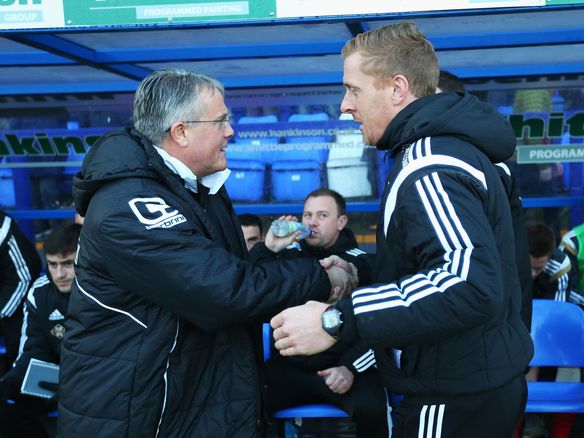 Tranmere manager Micky Adams shakes hands with Garry Monk