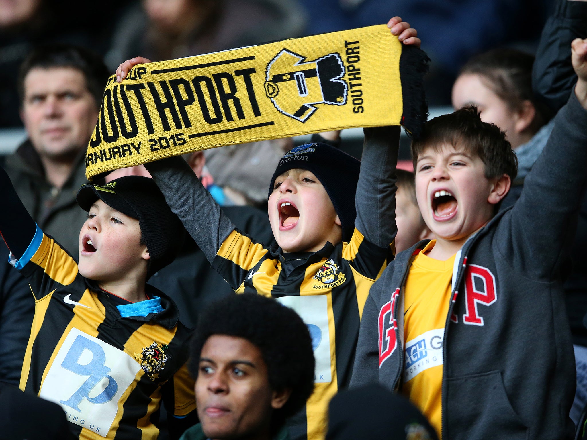 Southport fans support their team at the iPro Stadium