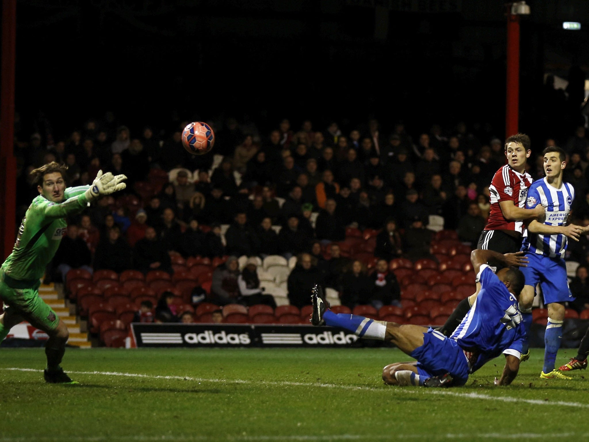 Lewis Dunk scores the opening goal late-on for Brighton