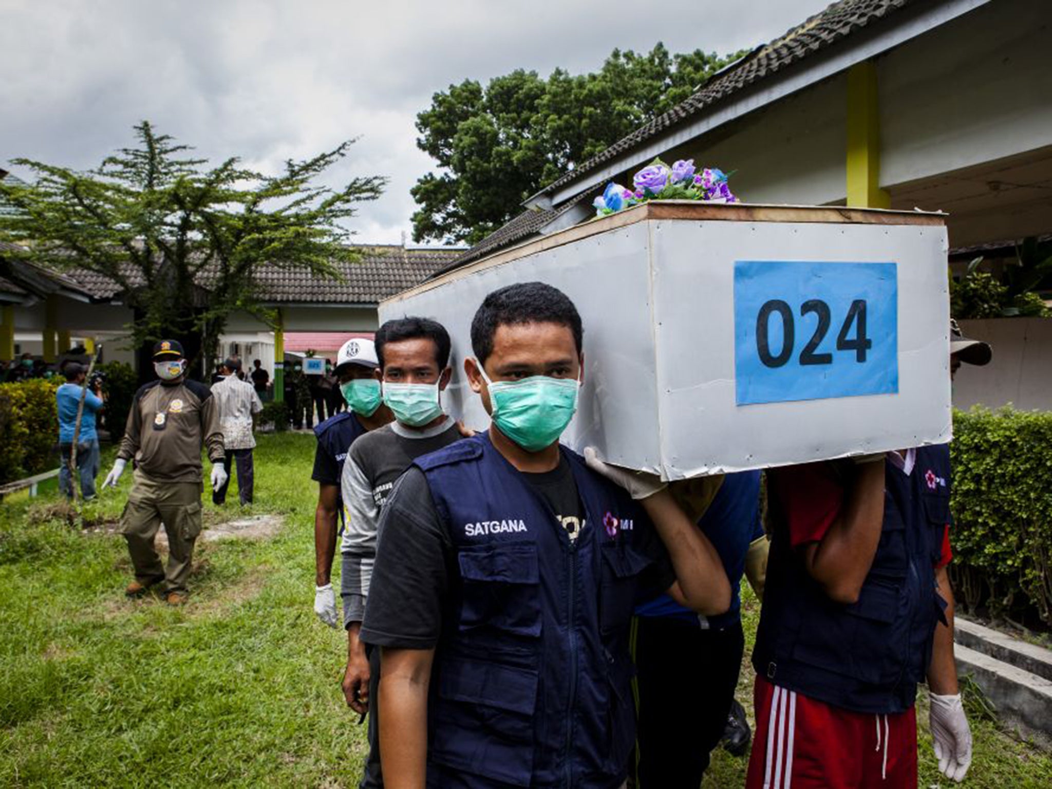 One of the 30 bodies recovered so far arrives in Indonesia on Saturday (Getty)