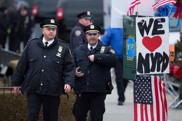 Police pay their respects to Wenjian Liu on Saturday (Getty)