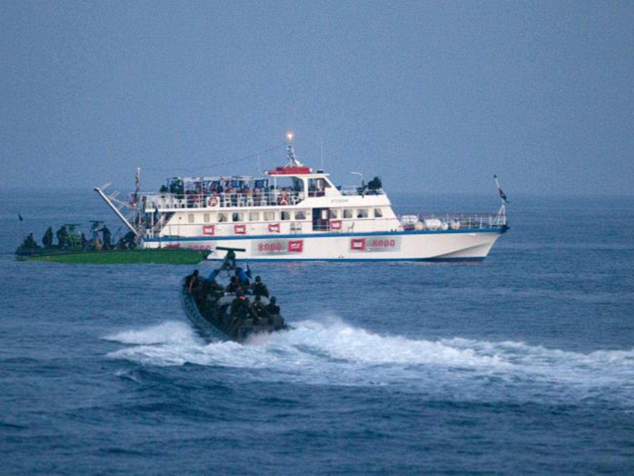 Israeli boats approach the flotilla (Getty)