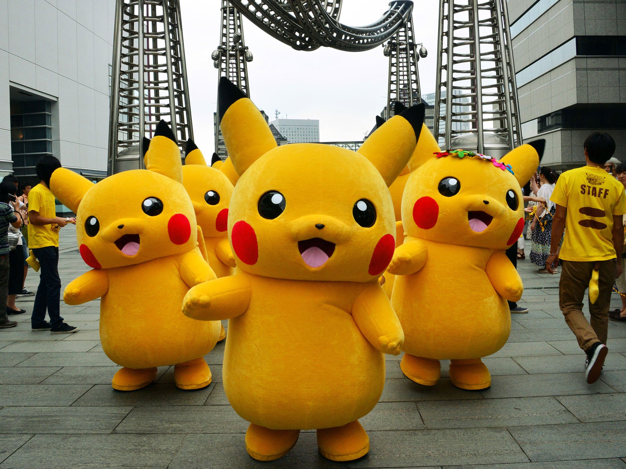 Dozens of Pikachu characters parade at the Landmark Plaza shopping mall Tokyo on 14 August, 2014