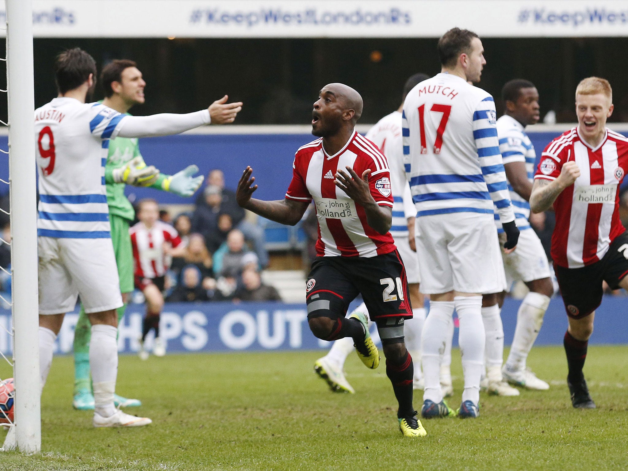 Sheffield United's English-Jamaican midfielder Jamal Campbell-Ryce (centre) celebrates after scoring their second goal against QPR