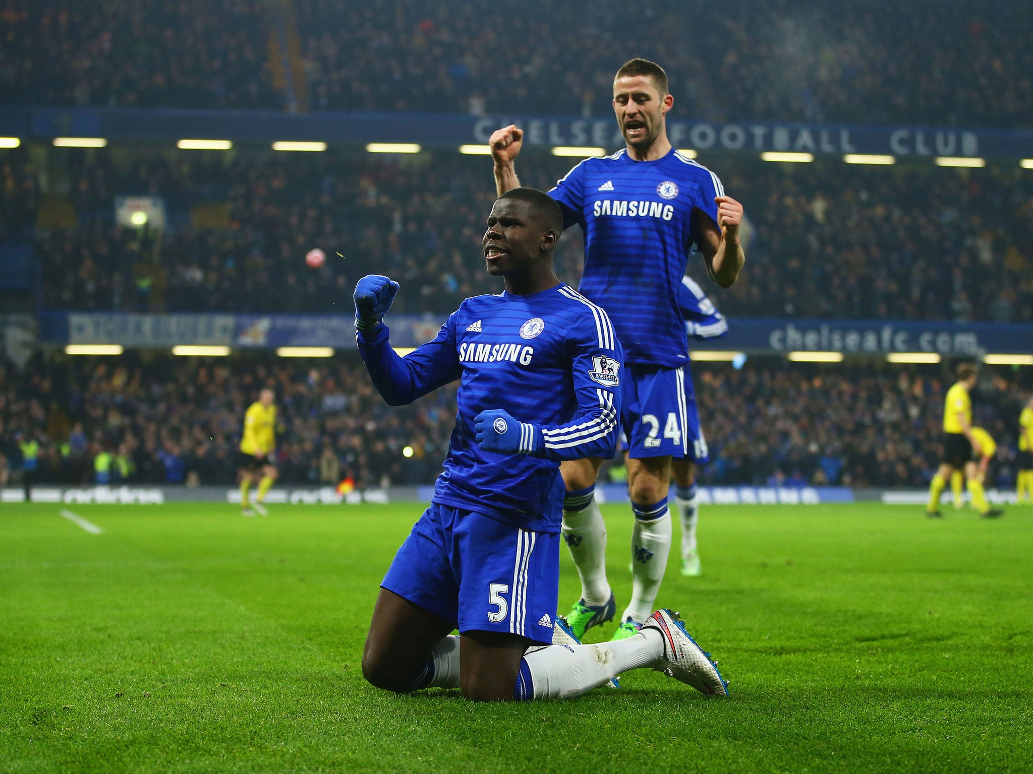 Zouma (5) celebrates with Cahill (24) as he scores Chelsea's third