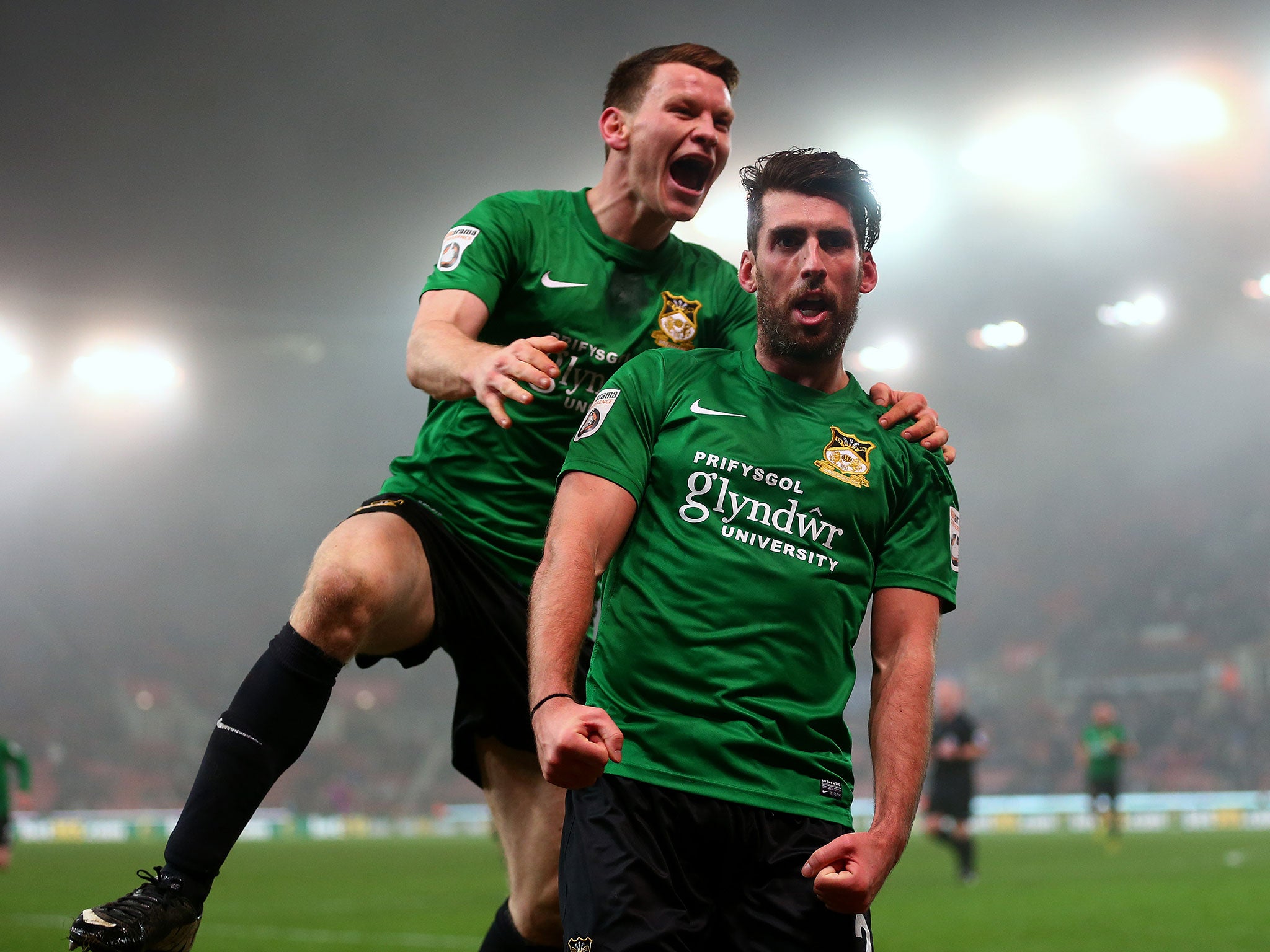 Mark Carrington (front) celebrates putting Wrexham ahead