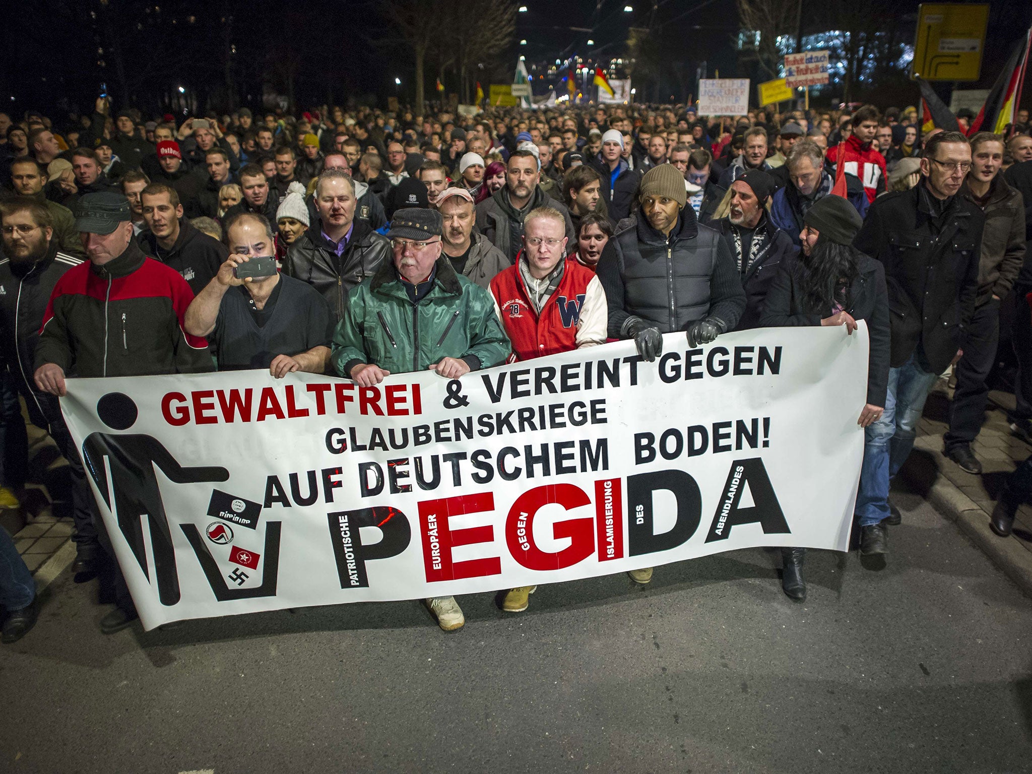 Supporters of the PEGIDA movement, 'Patriotische Europaeer gegen die Islamisierung des Abendlandes,' which translates to 'Patriotic Europeans Against the Islamification of the Occident'