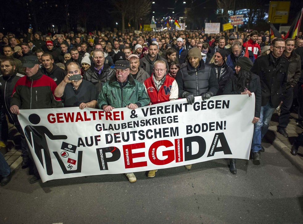 Supporters of the PEGIDA movement, 'Patriotische Europaeer gegen die Islamisierung des Abendlandes,' which translates to 'Patriotic Europeans Against the Islamification of the Occident'