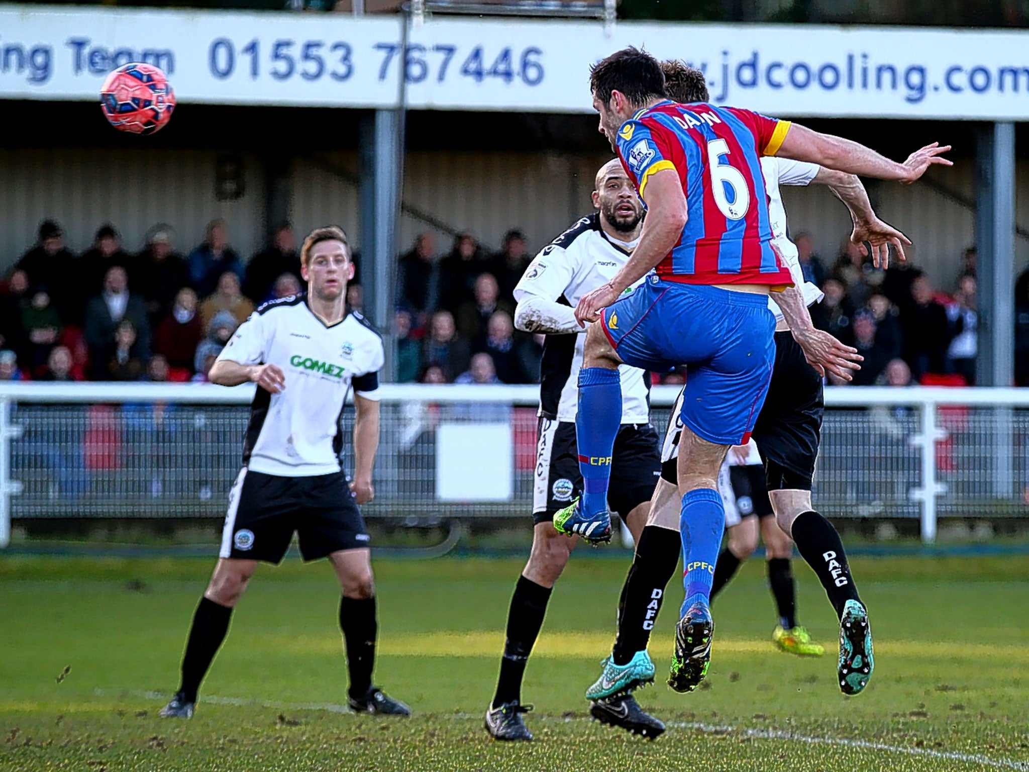 Scott Dann heads home his second goal for Crystal Palace at Dover on Sunday