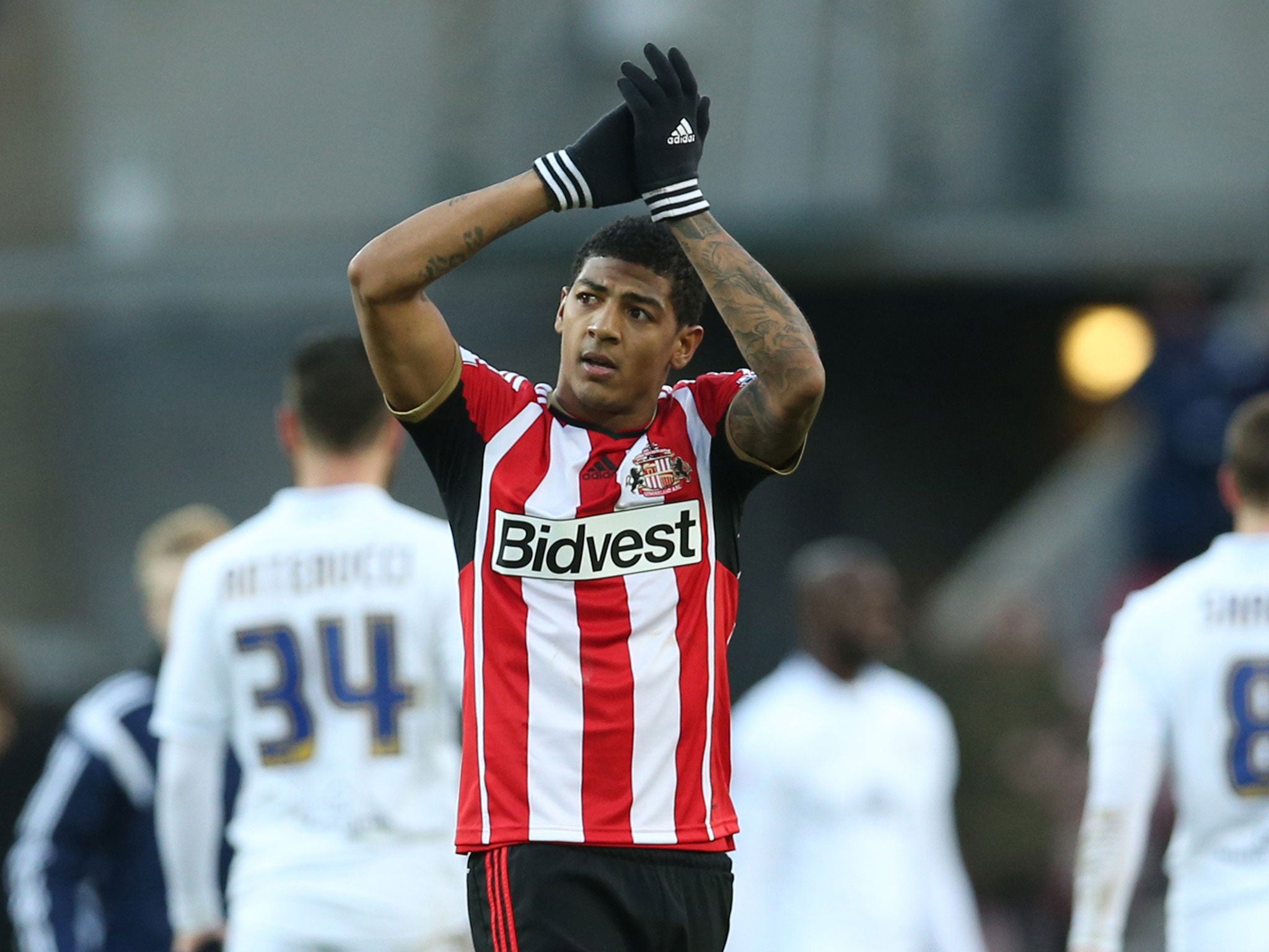 Patrick van Aanholt applauds Sunderland supporters after his goal was enough to beat Leeds United at the Stadium of Light