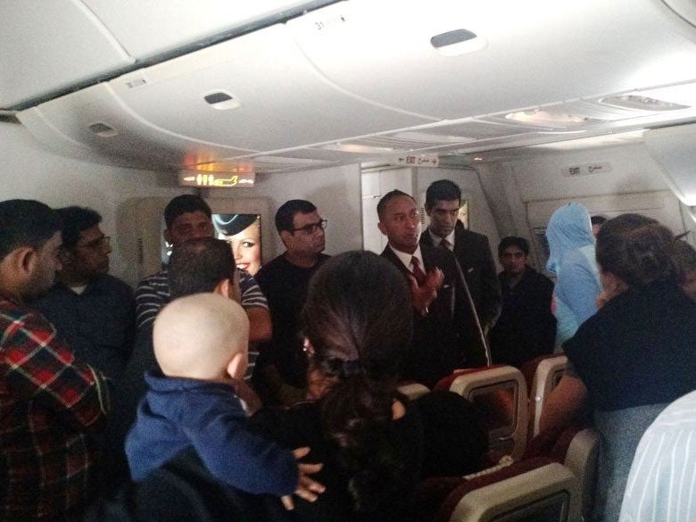This photo provided by Rithvik Reddy shows passengers aboard Etihad Airways Flight EY 183 who where stuck on the tarmac for 12 hours on 3 January 2015