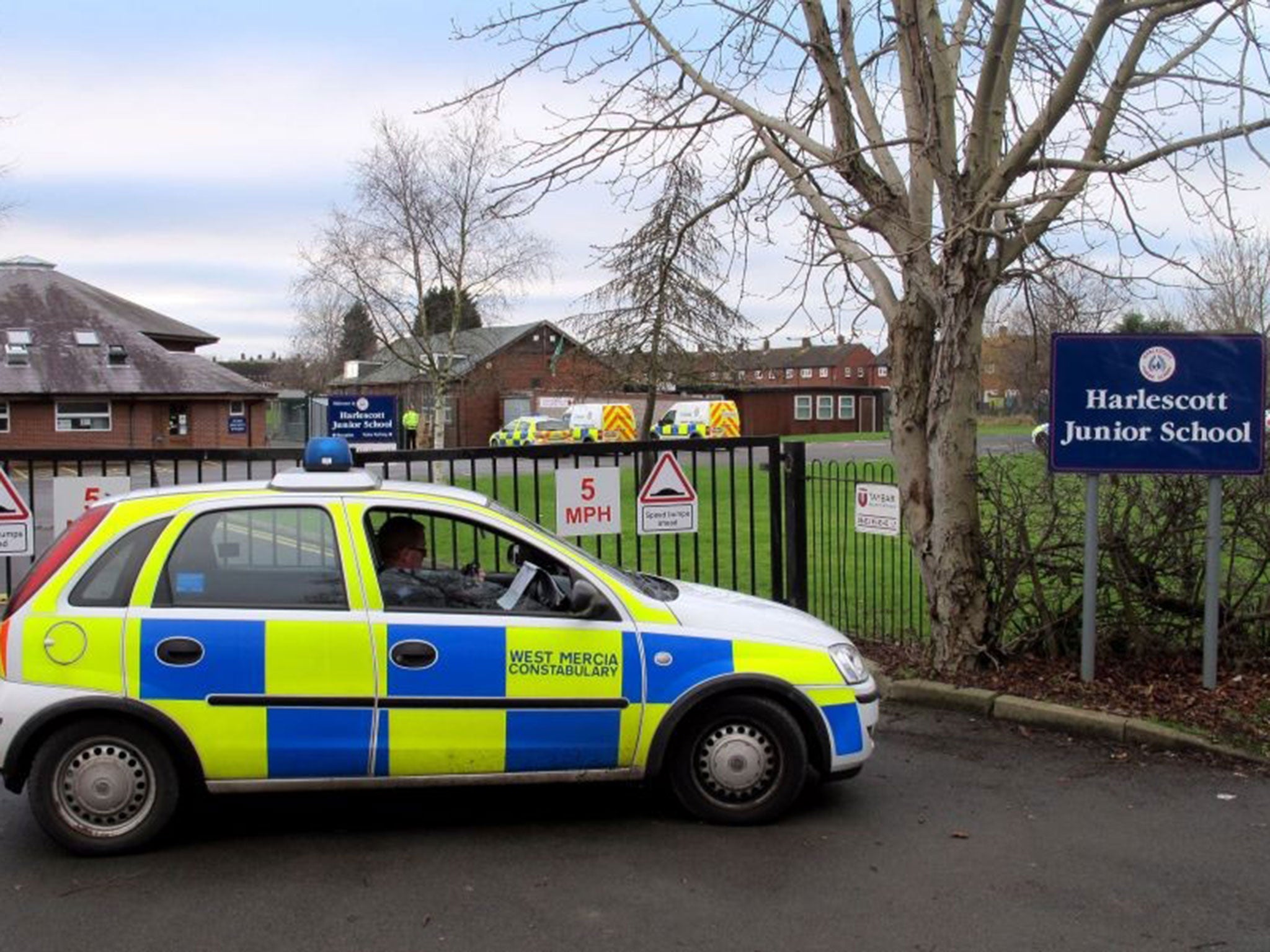 Police outside Harlescott Junior School in Shrewsbury after a woman was found dead