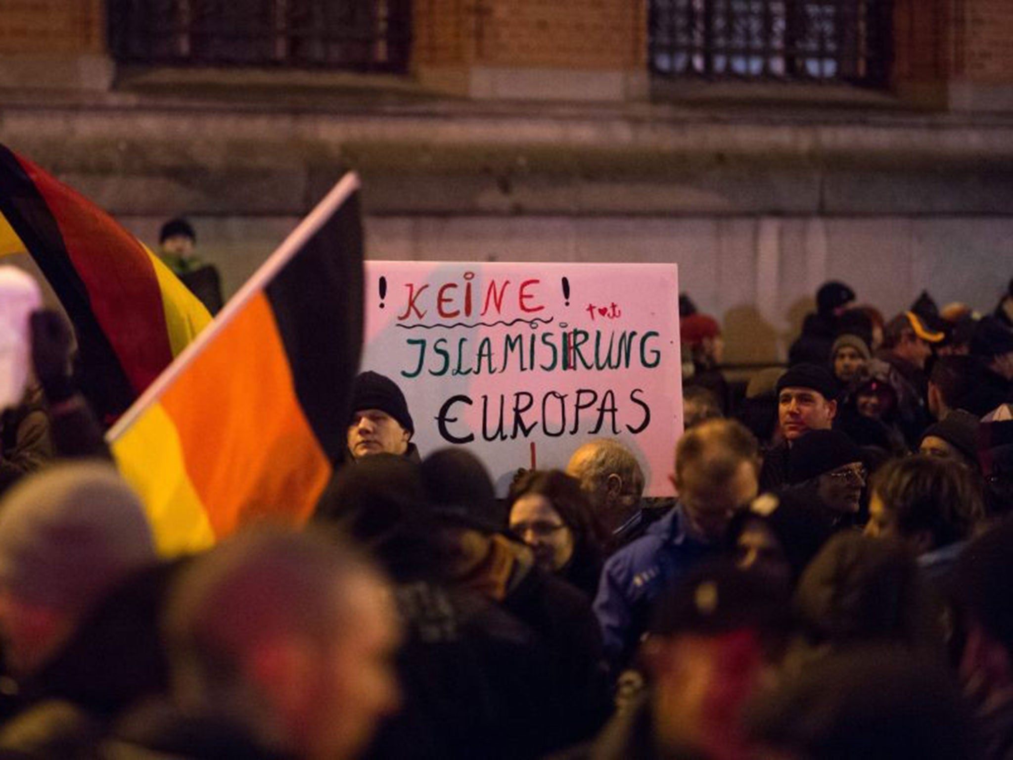 Pegida supporters hold a banner reading 'No islamization of Europe' in Berlin on 5 December