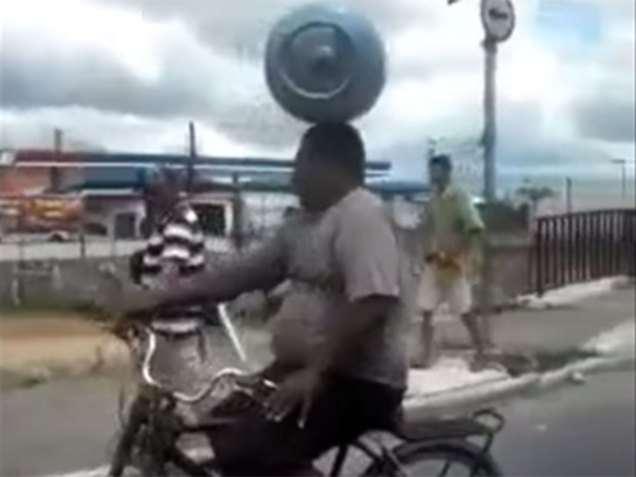 The man was filmed waiting at a busy junction in Sao Paulo