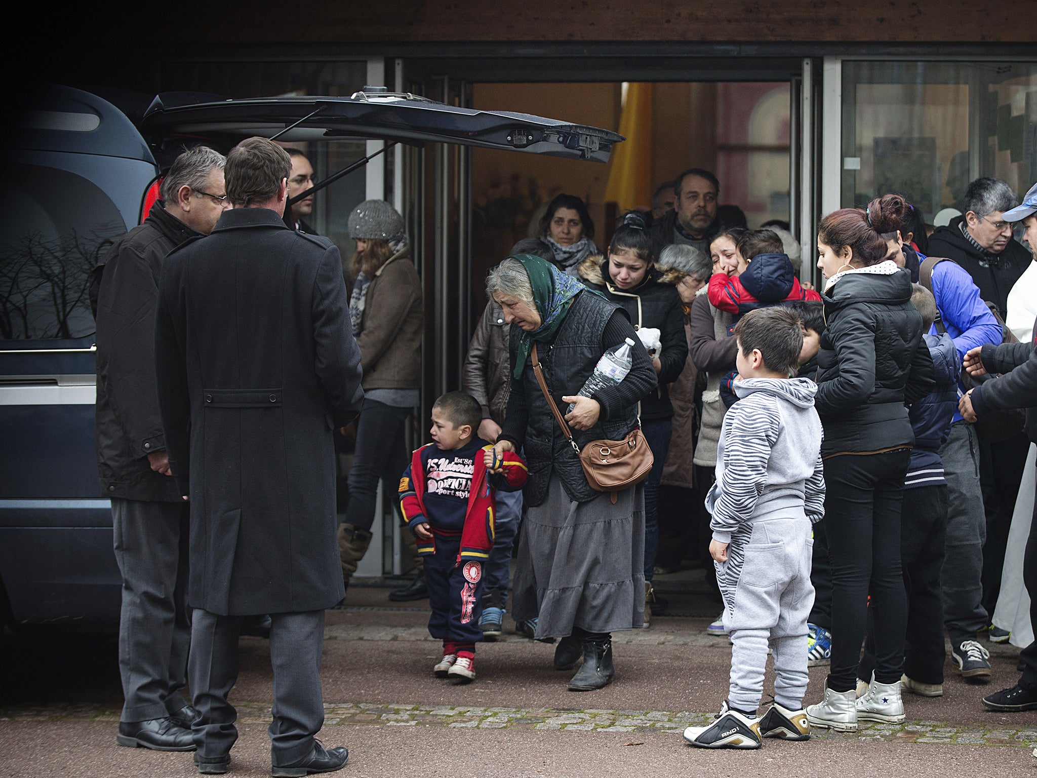 People attend the funeral of late Maria Francesca on January 5, 2015 at the Wissous cemetery.