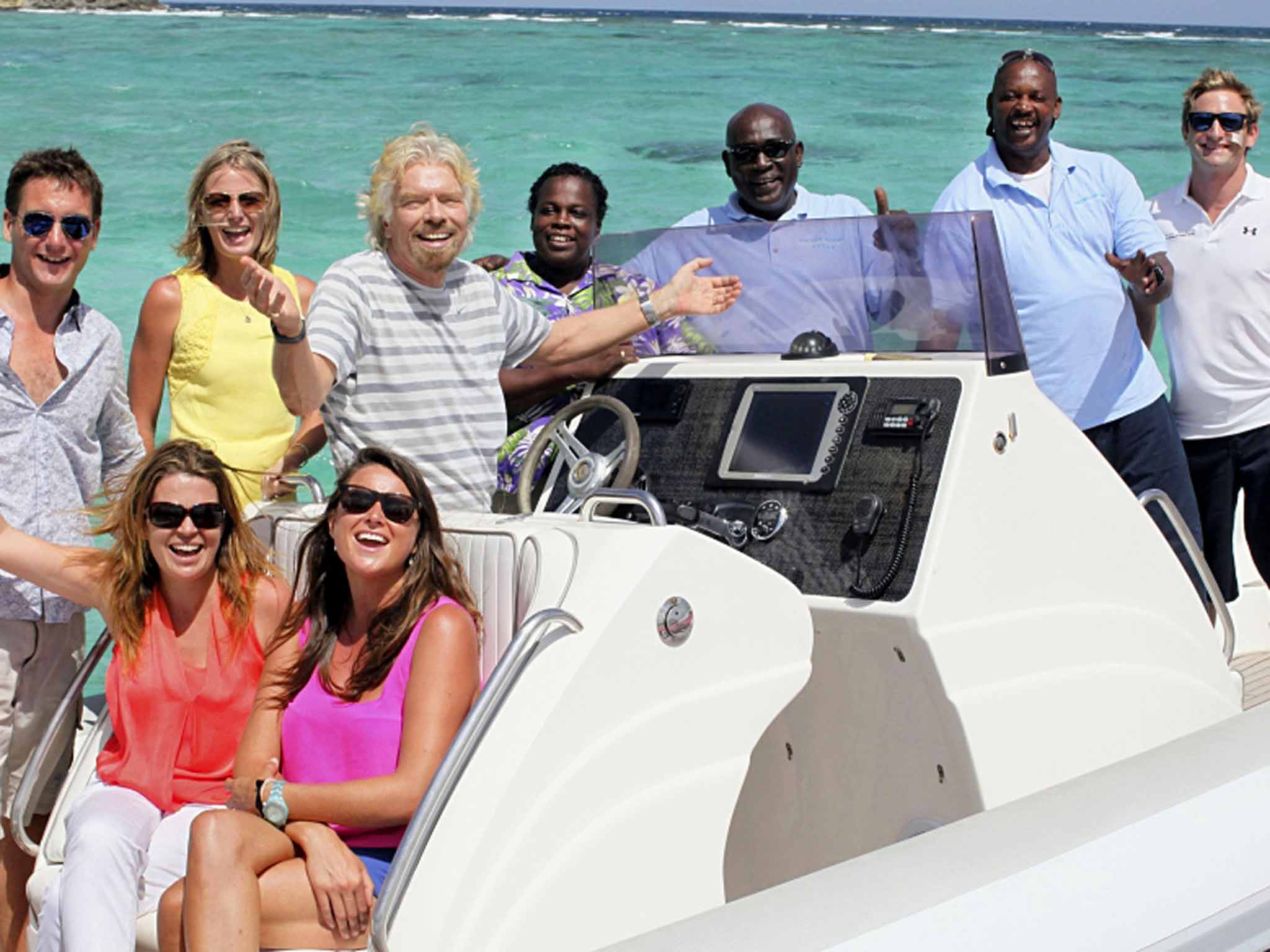 Richard Branson kiteboarding with naked model in the British Virgin Islands