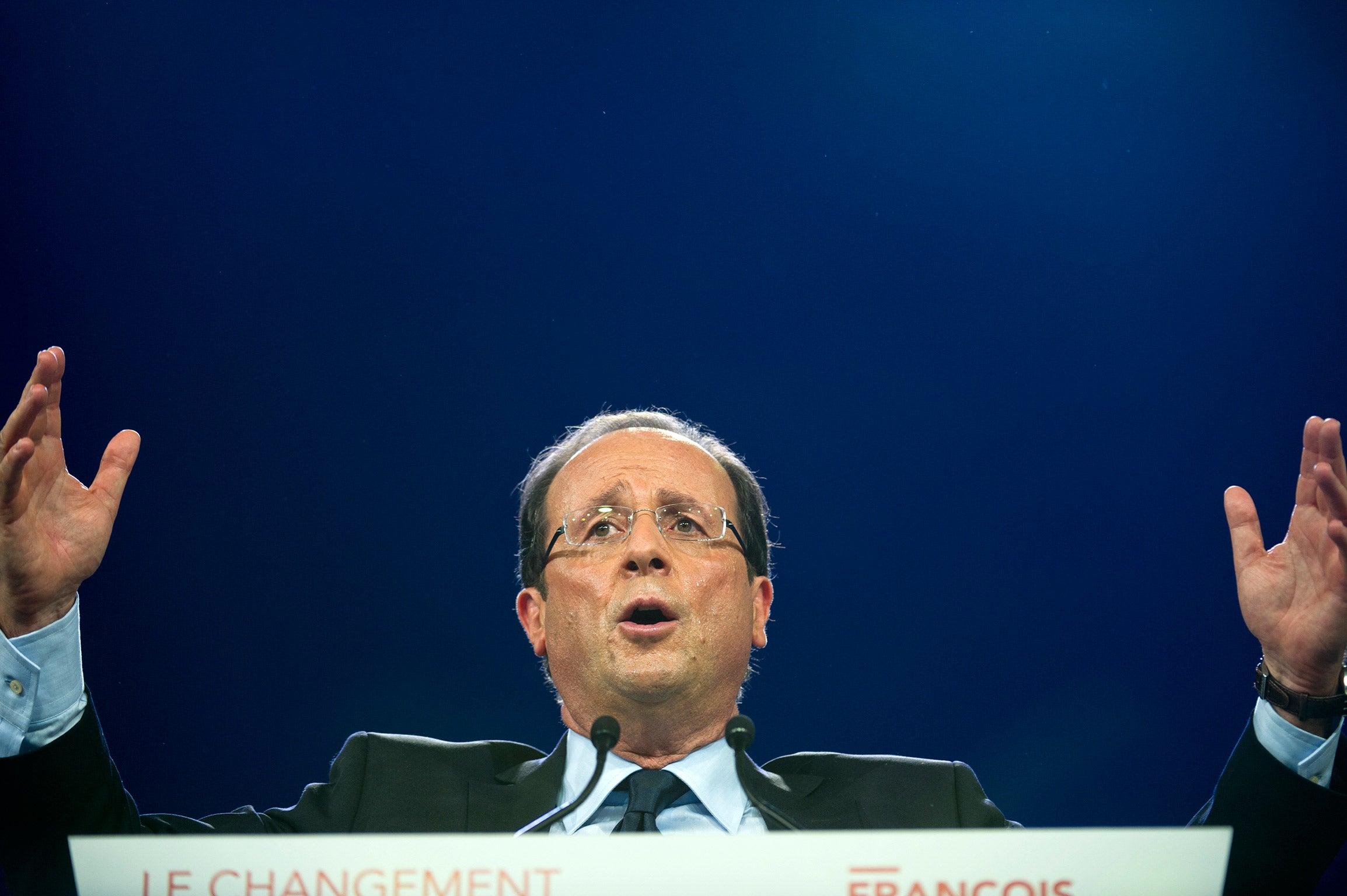 Barn-storming: Hollande delivers a speech at Le Bourget airport in 2012 (Getty)