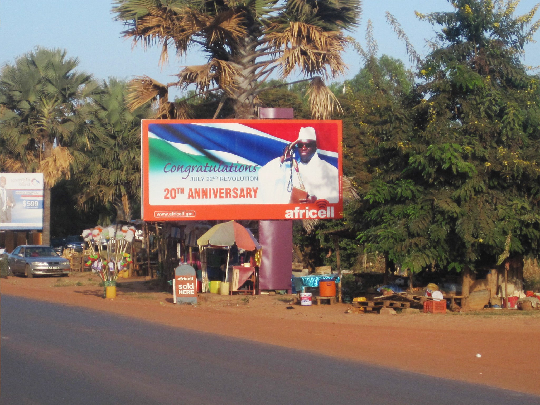 A giant billboard of President Yahya Jammeh sits on an empty street in Banjul, Gambia