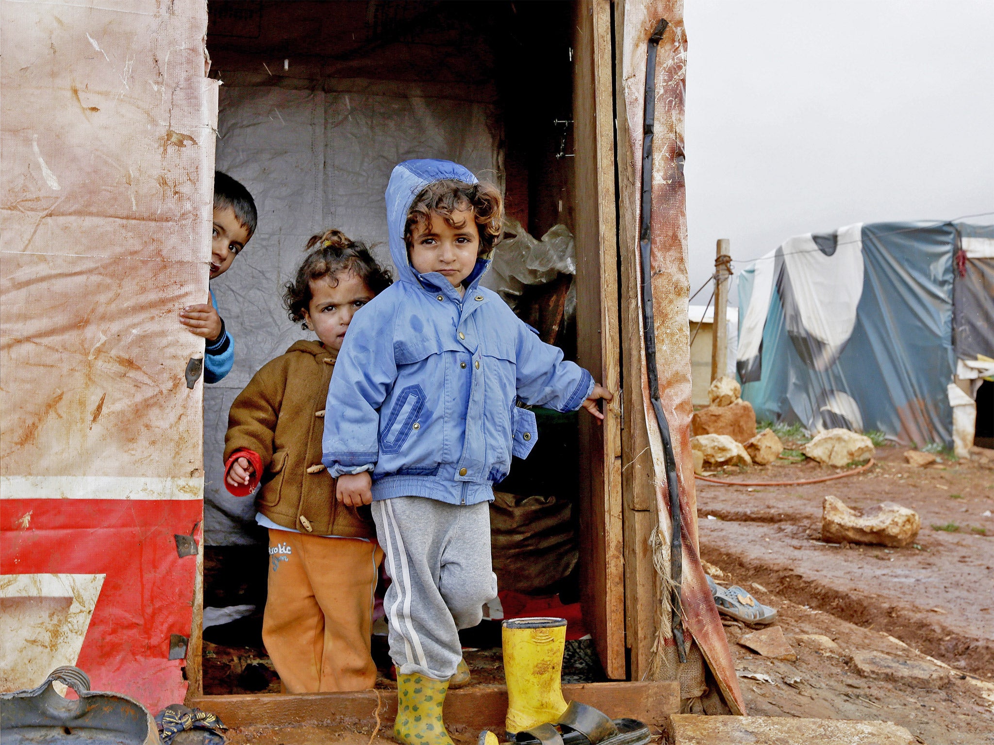 Children who fled the violence in the Syrian city of Aleppo play at a refugee camp in Jabaa, in Lebanon’s Bekaa Valley
