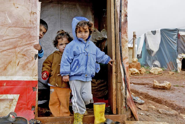 Children who fled the violence in the Syrian city of Aleppo play at a refugee camp in Jabaa, in Lebanon’s Bekaa Valley 