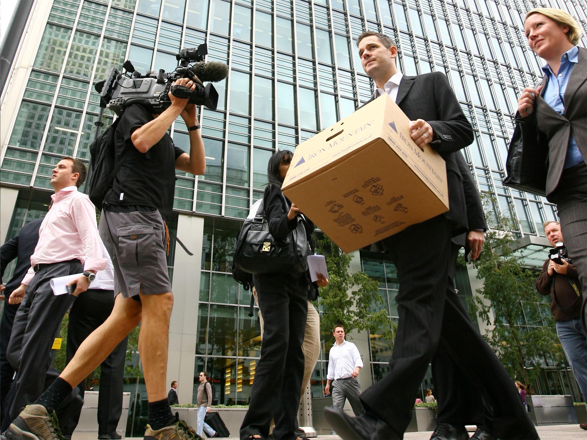 A Lehman Brothers employee leaves the bank’s European headquarters (Getty)
