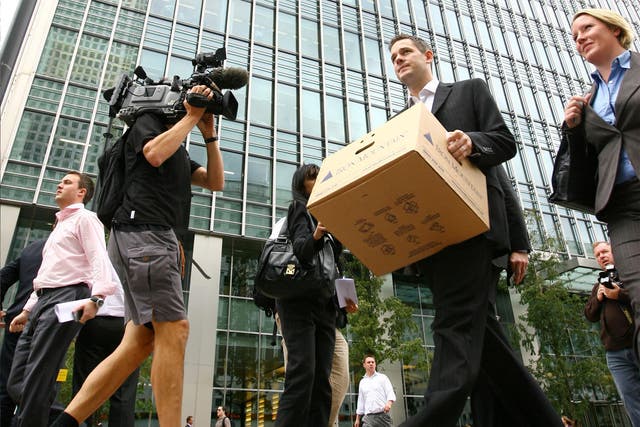 A Lehman Brothers employee leaves the bank’s European headquarters (Getty)