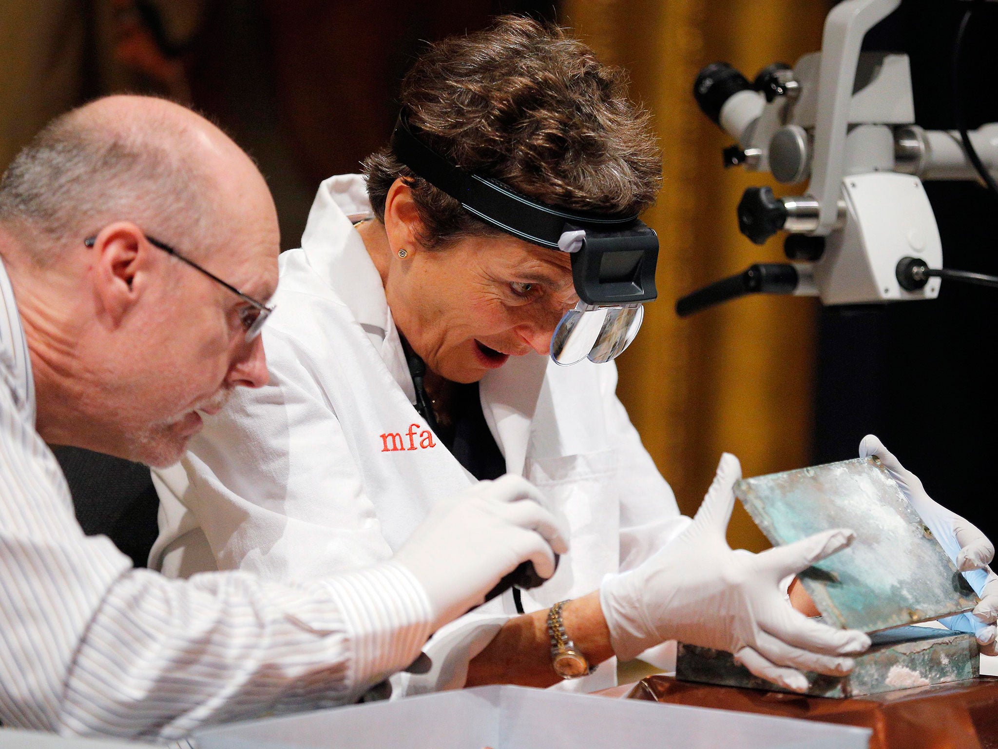 Executive Director of the Massachusetts Archives, Michael Comeau, and MFA conservator Pam Hatchfield open up the time capsule