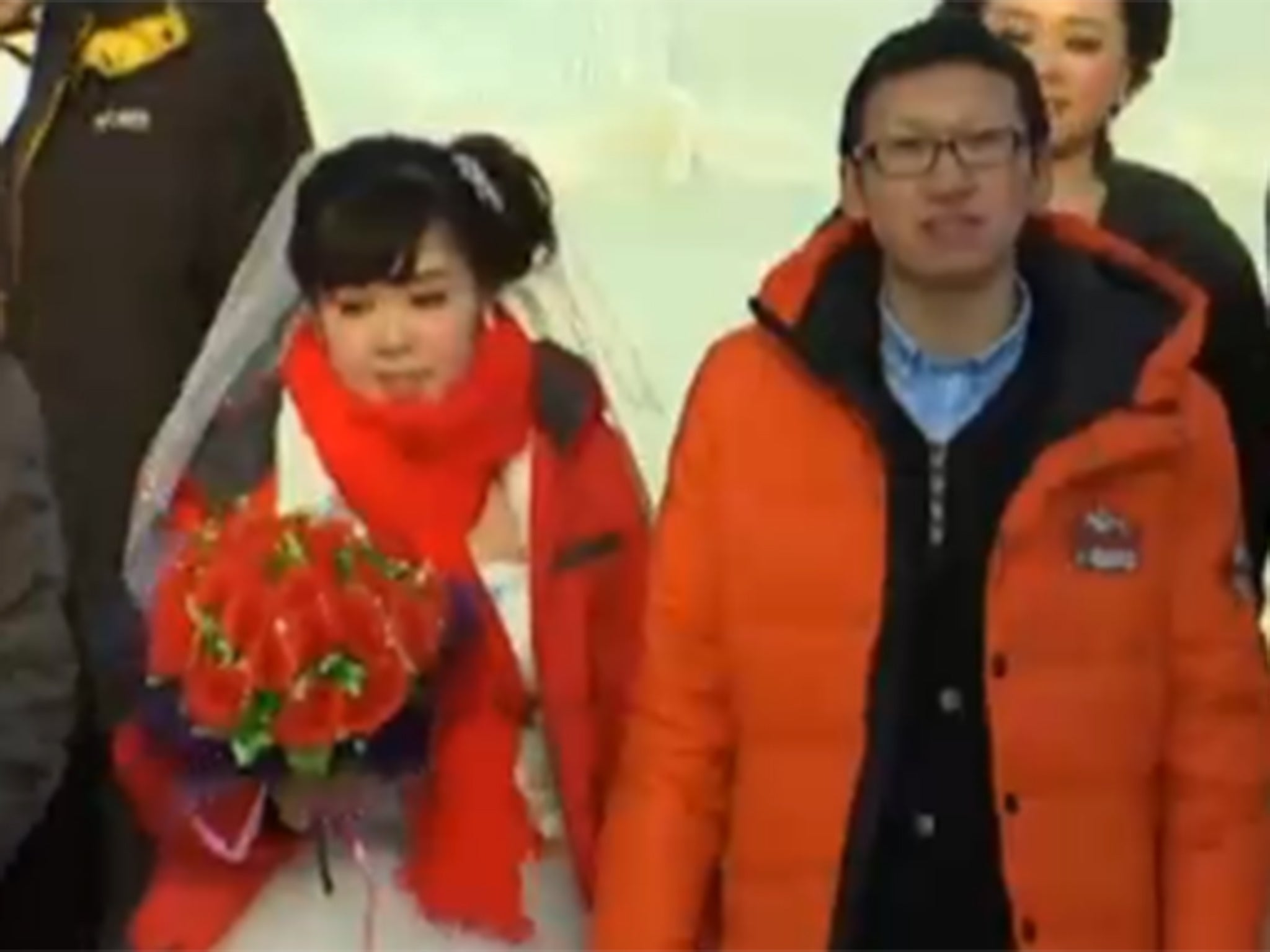 It's a little bit nippy: One of 11 couples tying the knot at the Harbin Ice Festival