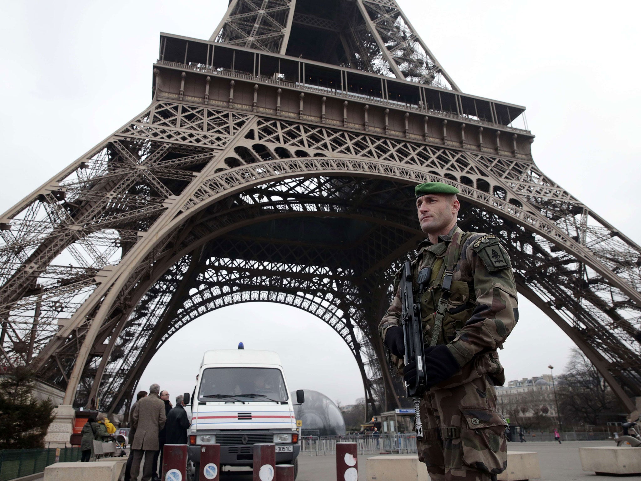 French soldiers patrol in front of the Eiffel Tower following the attack (Getty)