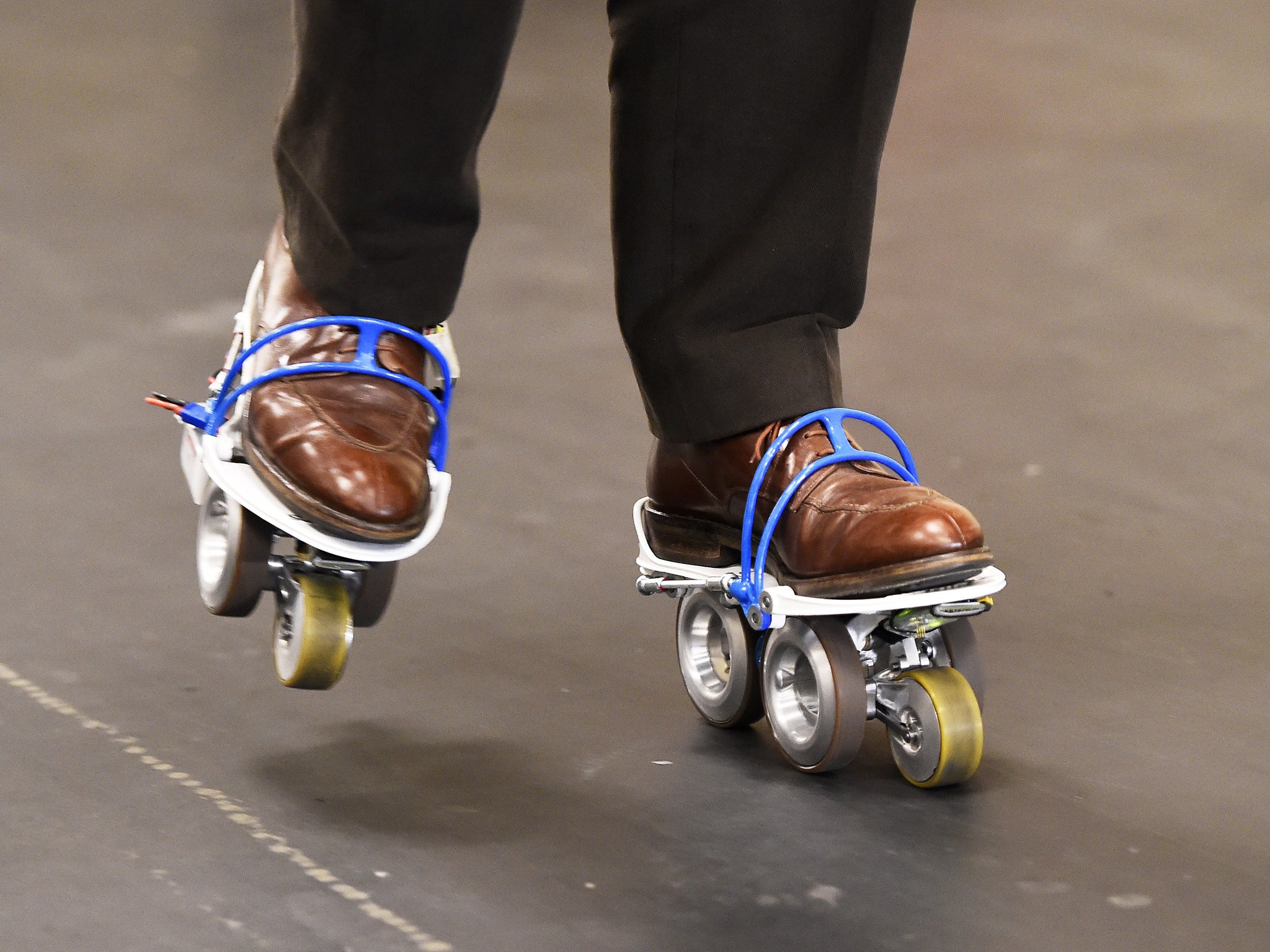 Rollkers, a transportation accessory that increases a person's average walking rate up to 7 miles per hour, is seen in use on January 4, 2014