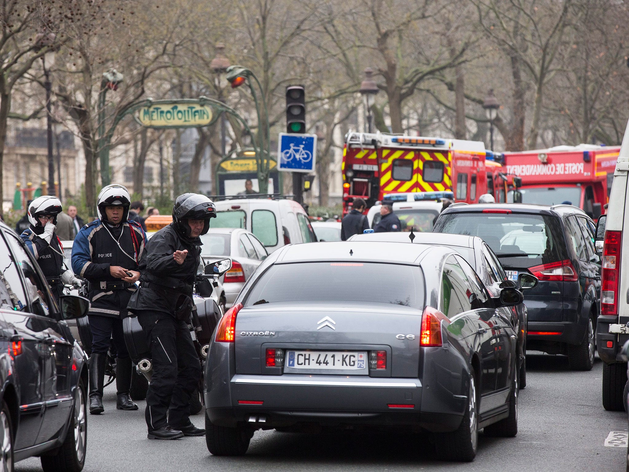 Police block the roads next to the 'Charly Hebdo' headquarter where a shoutout occurred in Paris