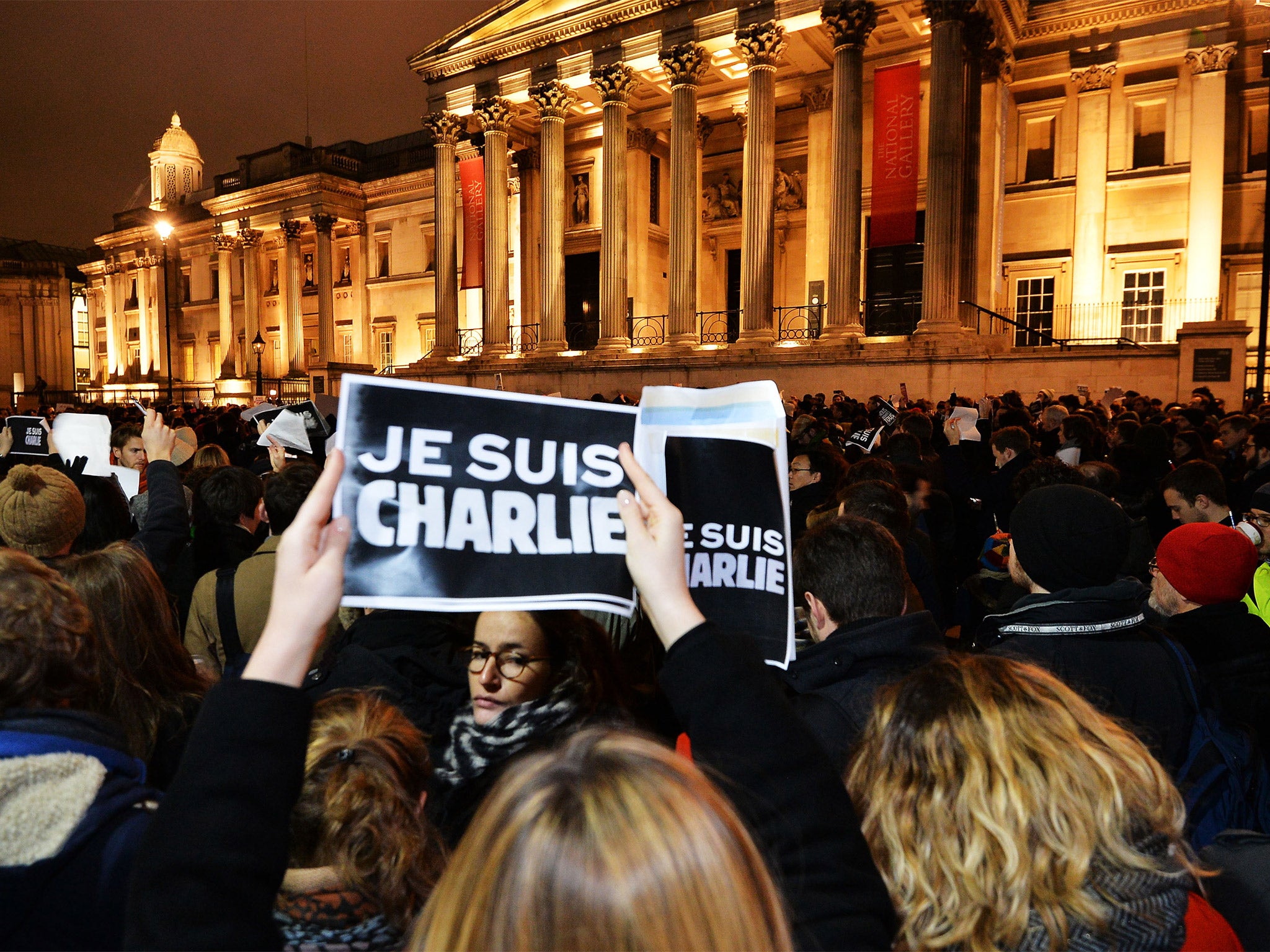 People take part in a vigil in Trafalgar Square, London, following the deadly terror attack on French satirical magazine Charlie Hebdo in Paris