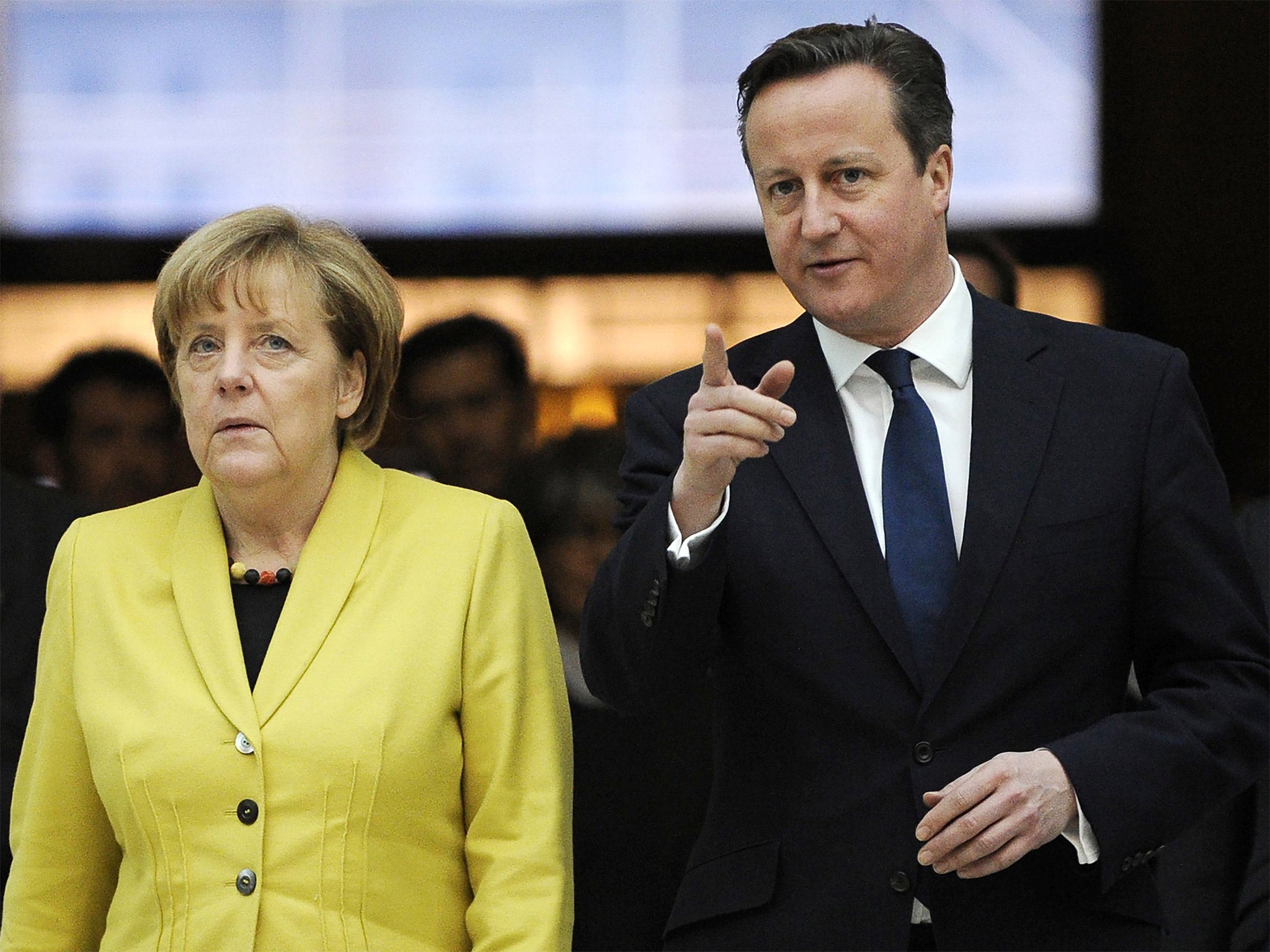 David Cameron accompanies German Chancellor Angela Merkel as they visit the British Museum in London