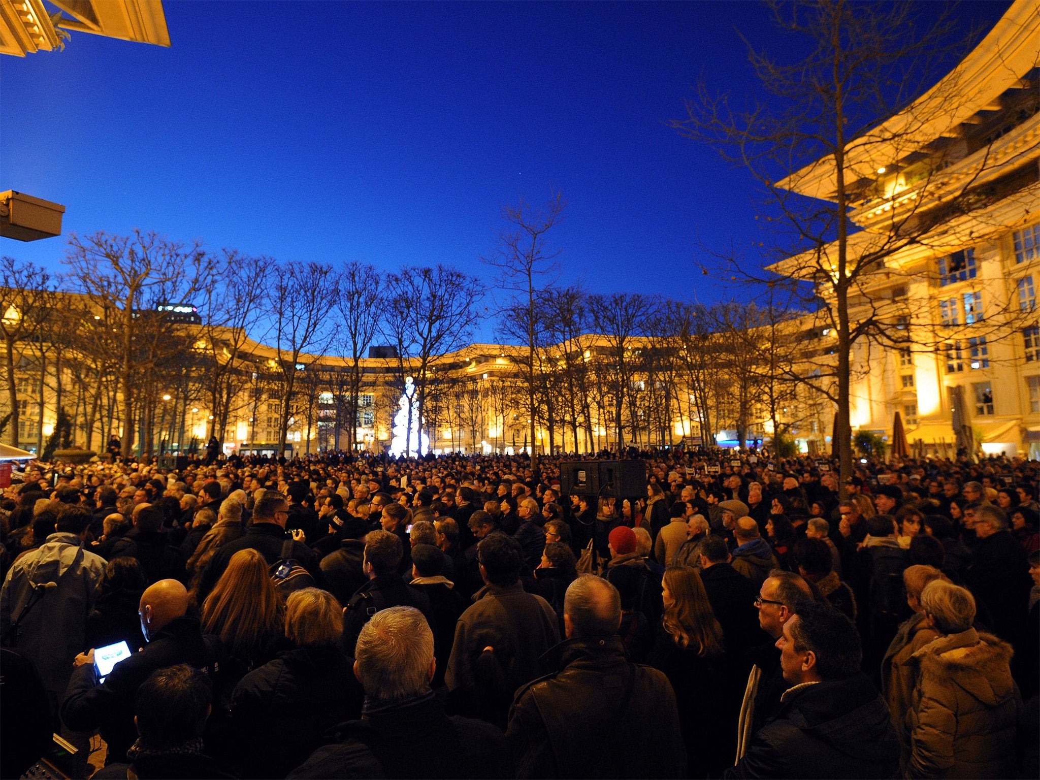 People gather in front of the 'Club de la presse' in Montpellier, to show their solidarity for the victims of the attack by unknown gunmen on the offices of the satirical weekly, 'Charlie Hebdo' (Getty)