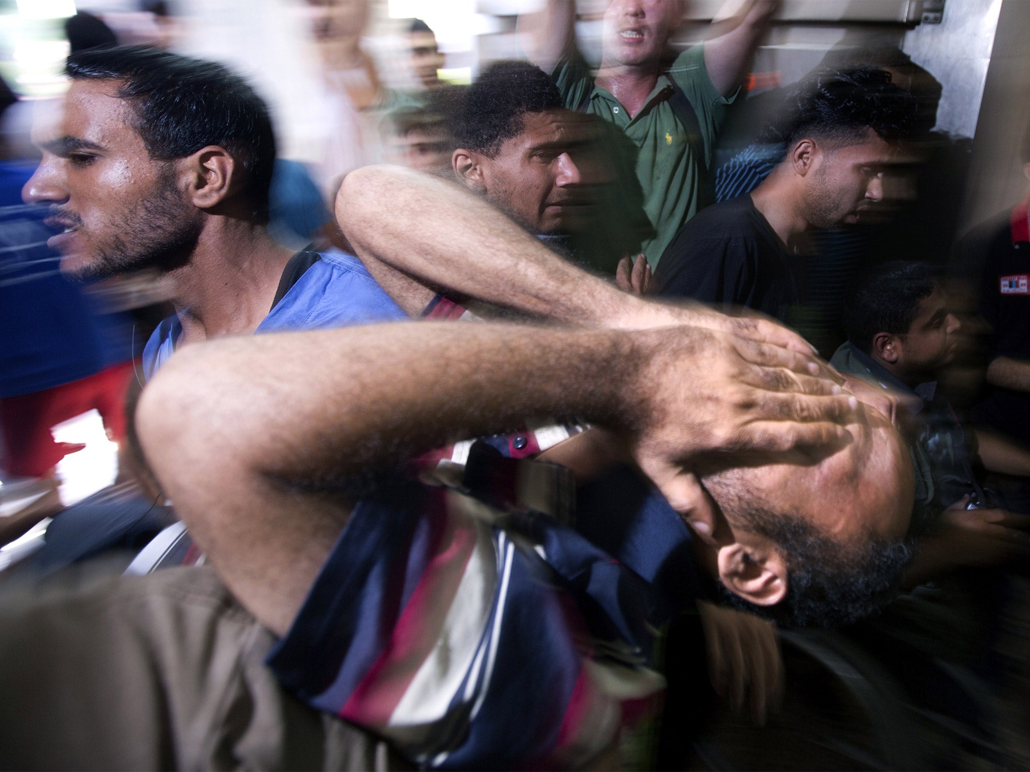 Grief-stricken relatives mourn in Gaza City after four children were killed in July last year by Israeli forces