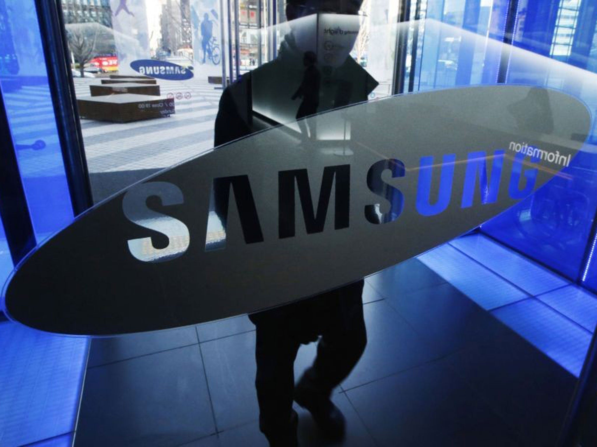 A man walks at the Samsung Electronics' headquarters in Seoul on 7 January, 2015