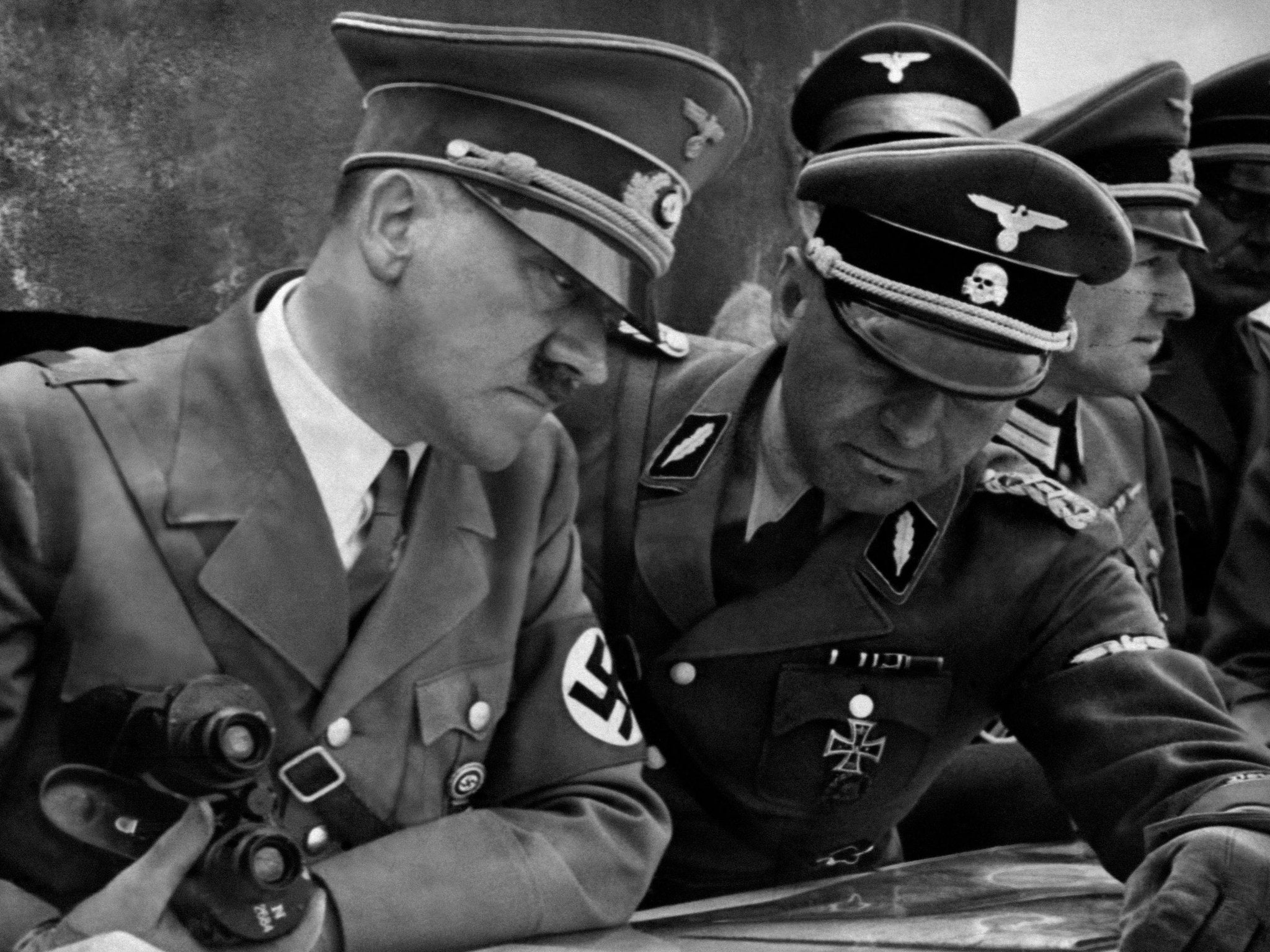 A picture dated 1939 shows German Nazi Chancellor and dictator Adolf Hitler consulting a geographical survey map