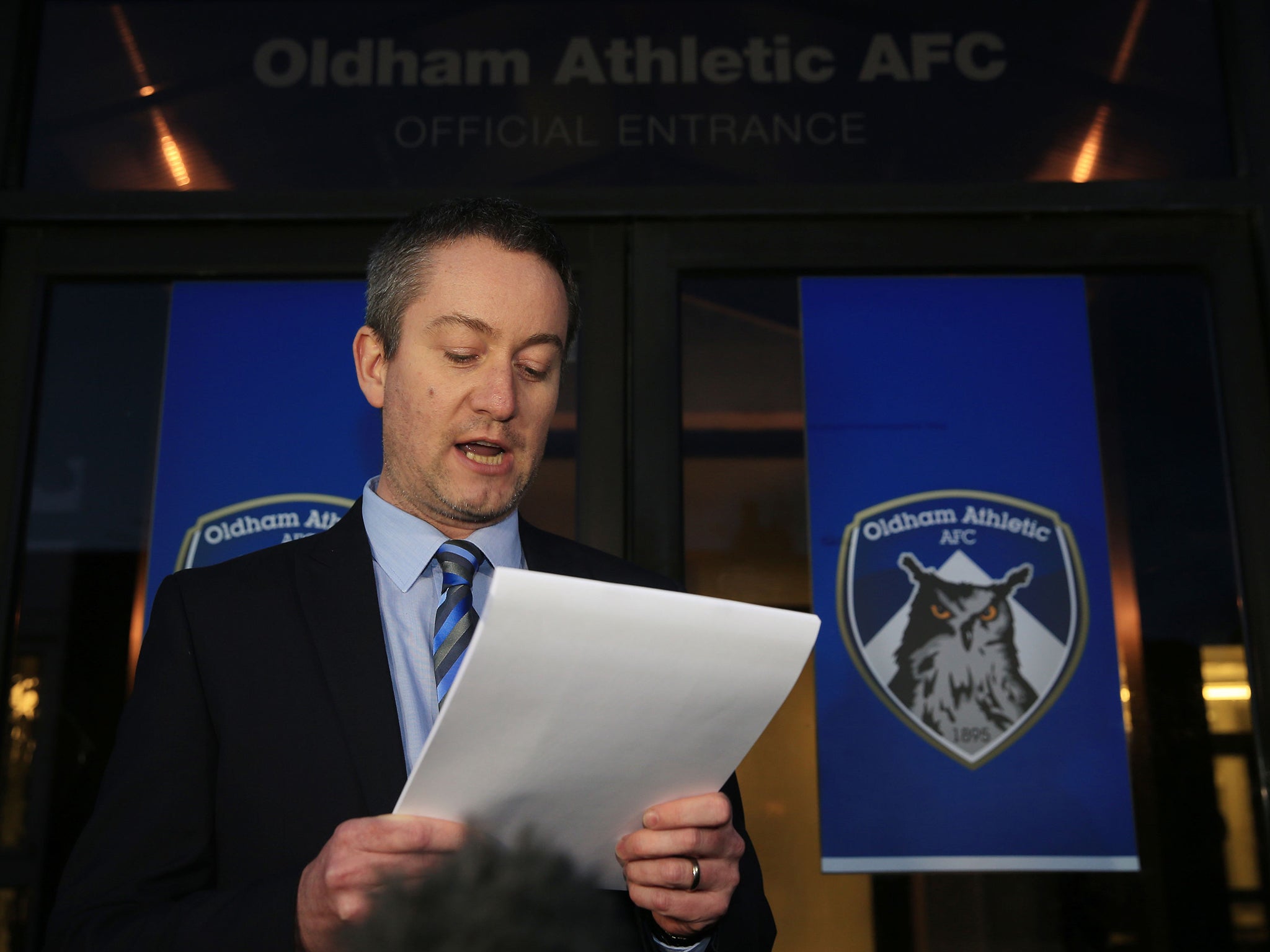 Oldham’s chief executive, Neil Joy, reads out a statement in relation to Evans